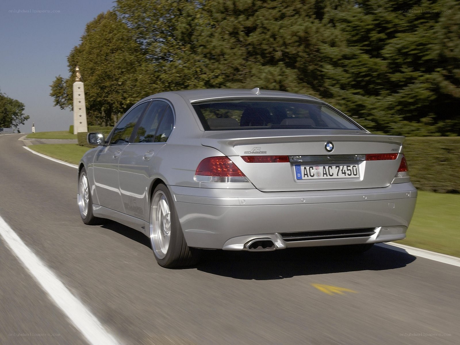 silver bmw driving on road