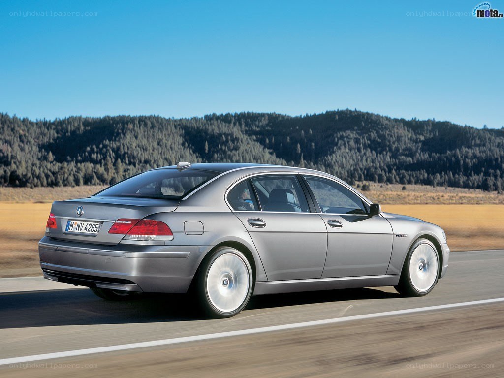 silver bmw driving on road