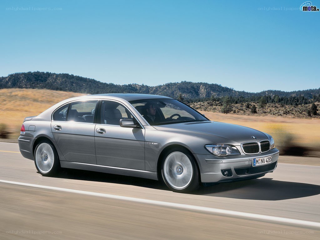 silver bmw driving on road