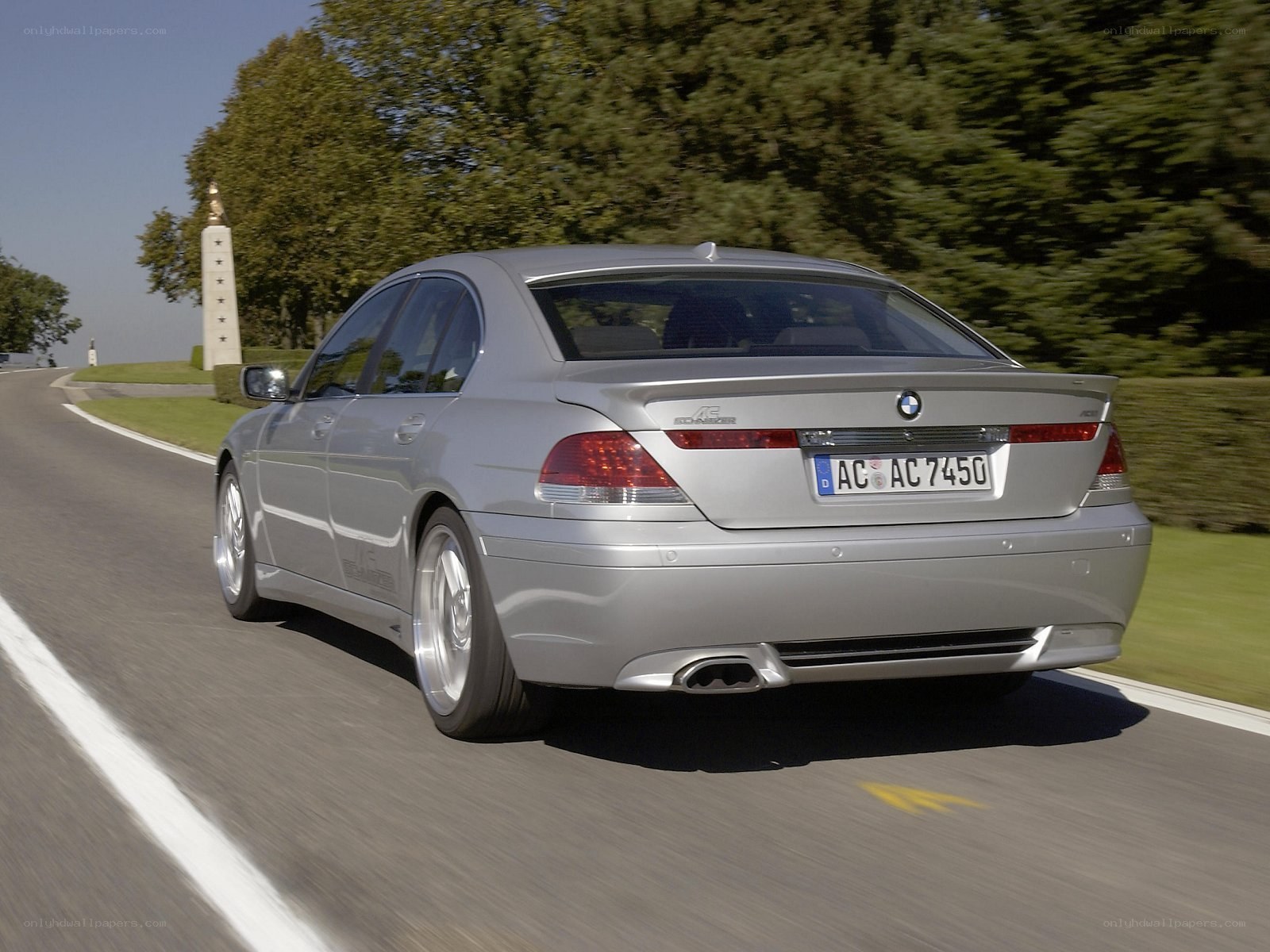 silver bmw driving on road