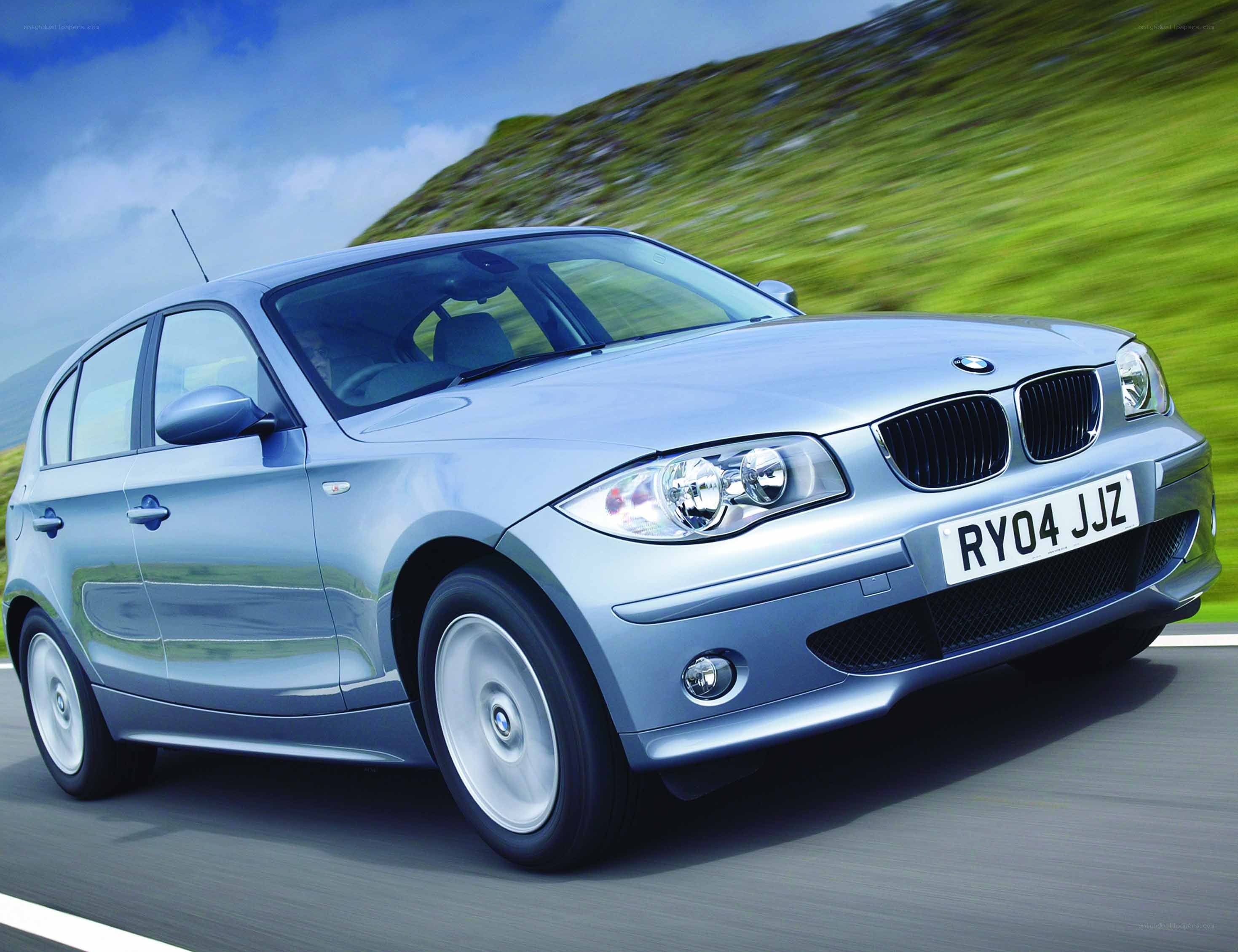 Silver BMW driving on road
