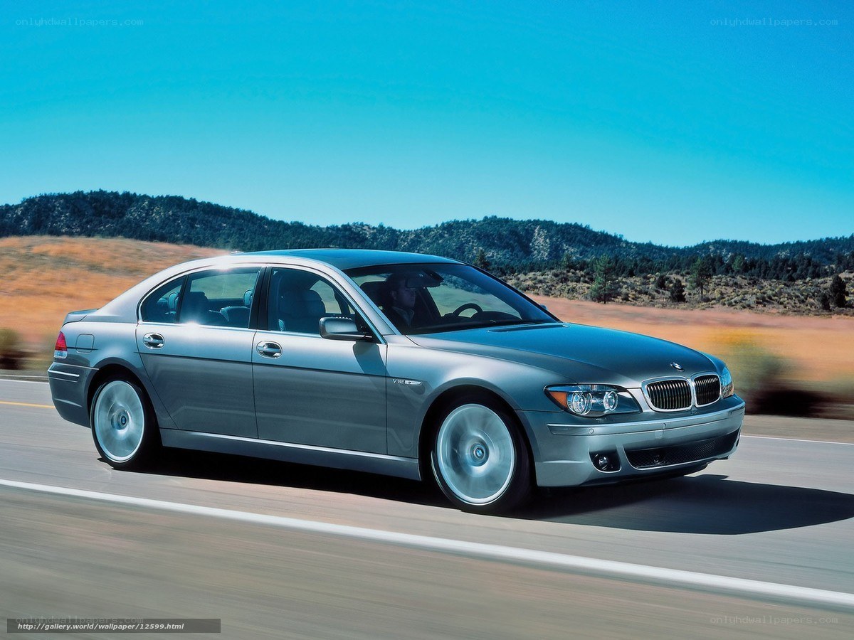 silver bmw driving on road