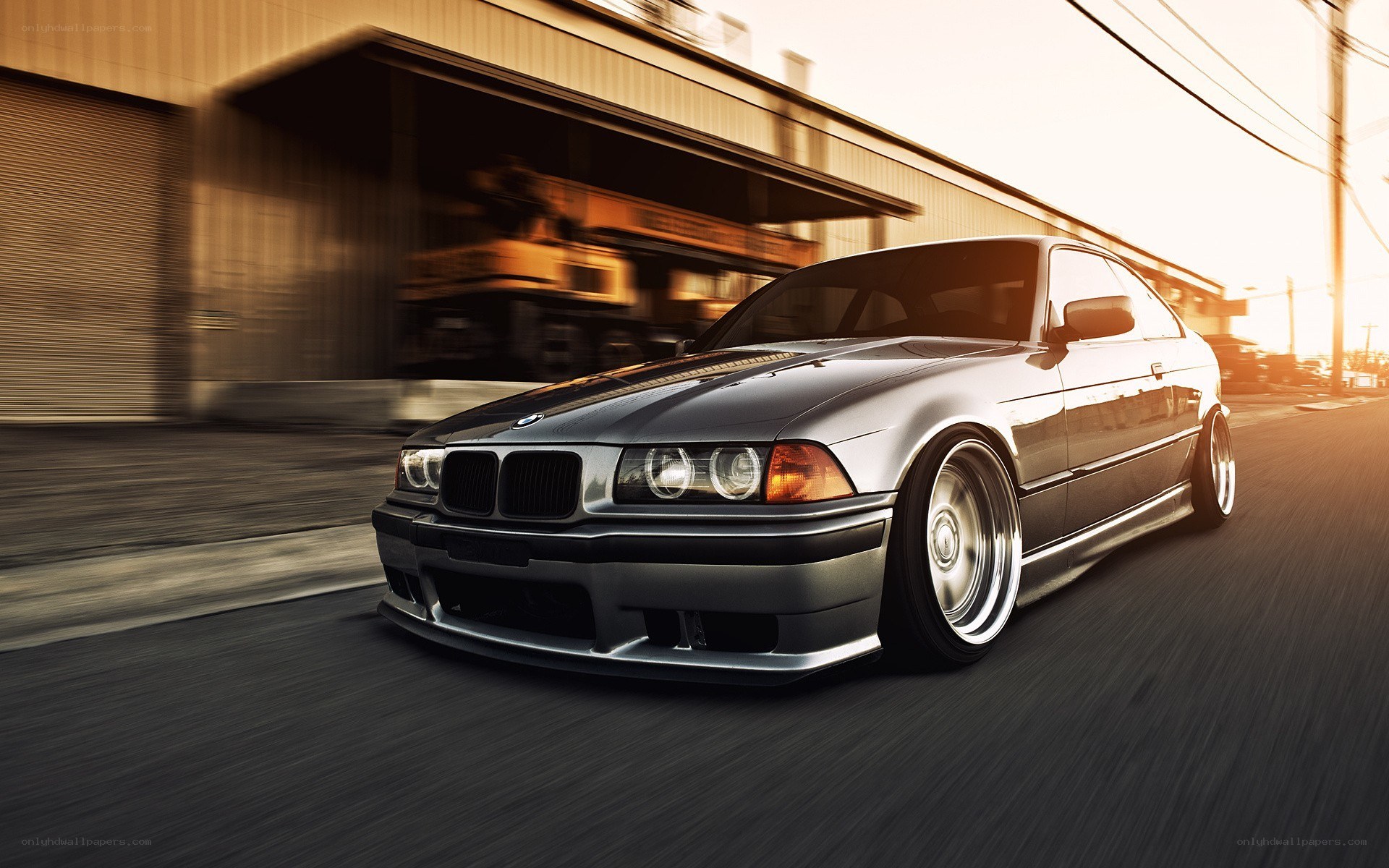 silver bmw driving on street