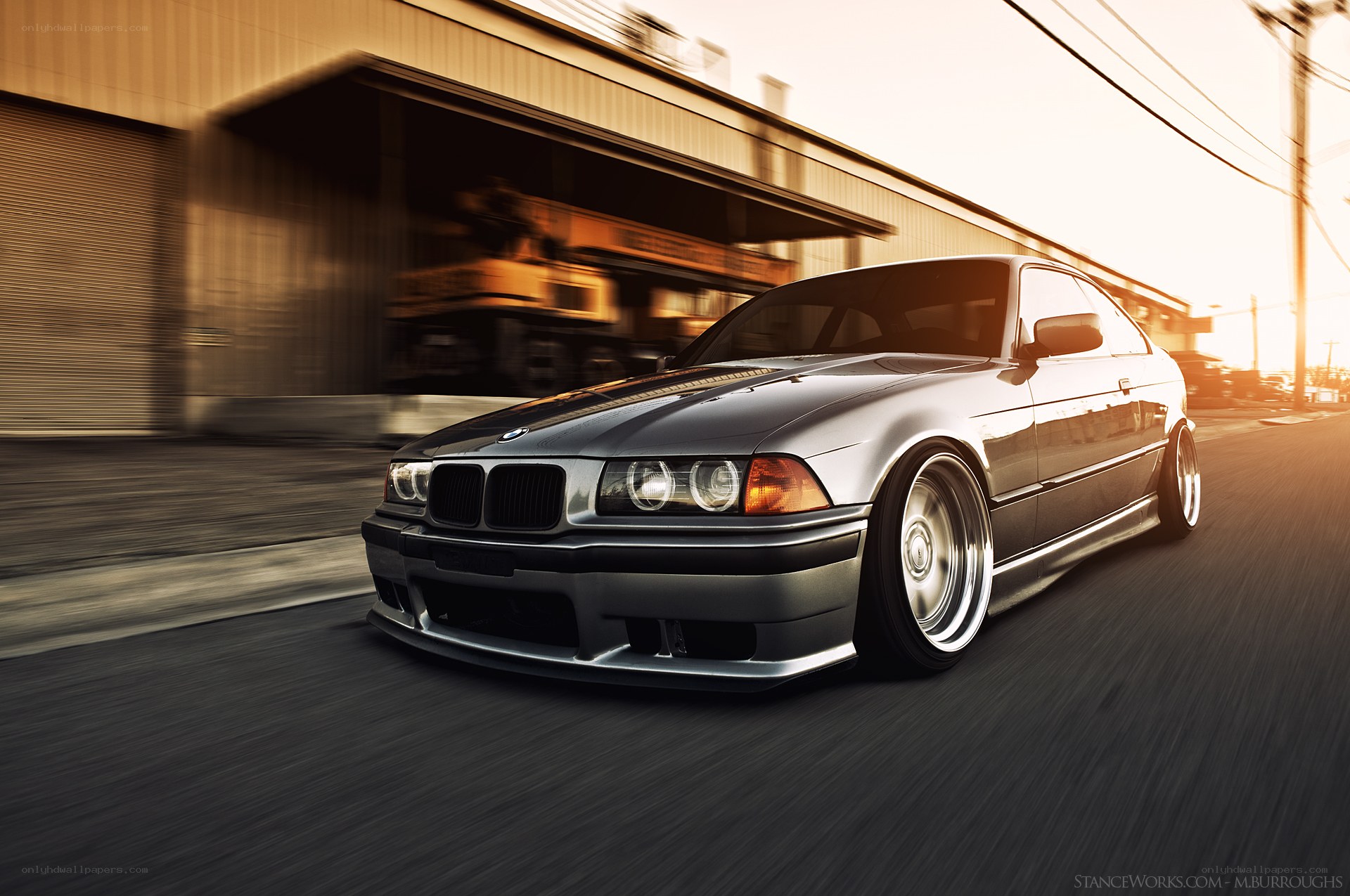 silver bmw driving on street