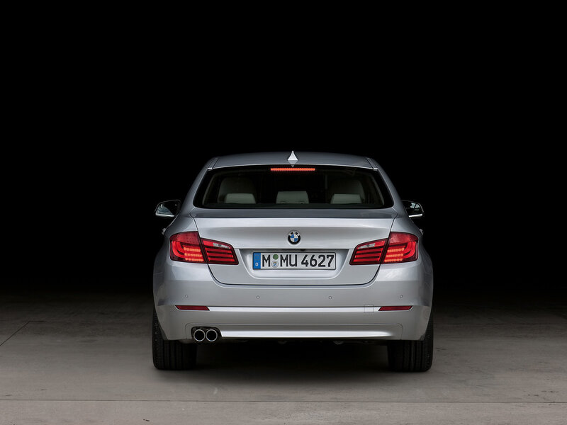 silver bmw from rear view