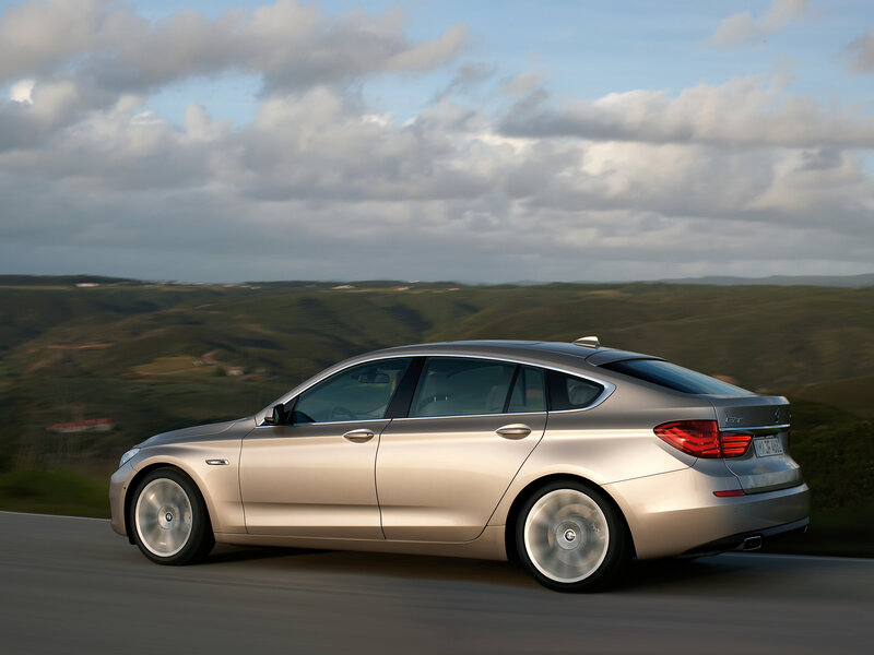 silver bmw gt on a scenic road