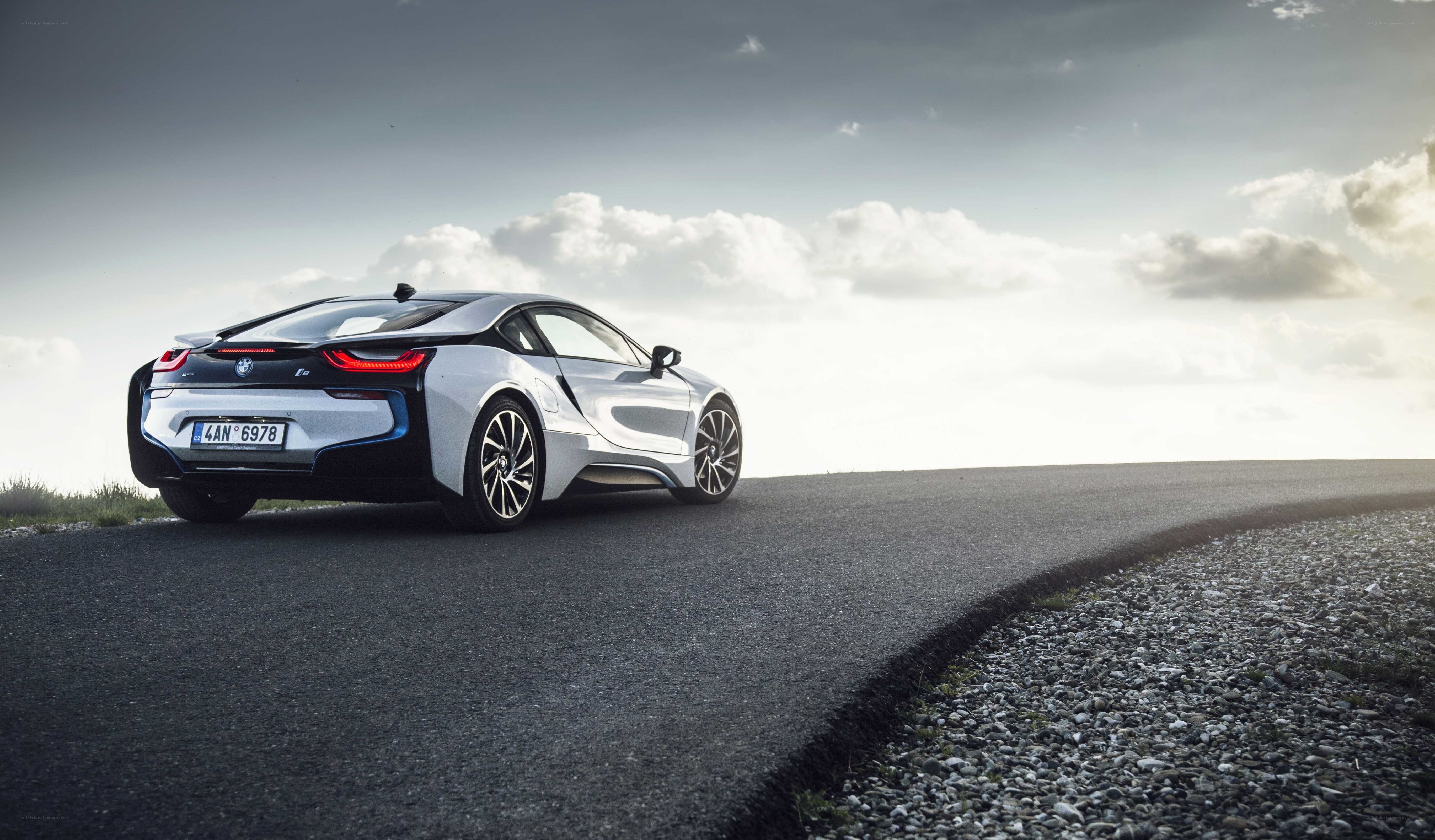 Silver BMW i8 on a winding road