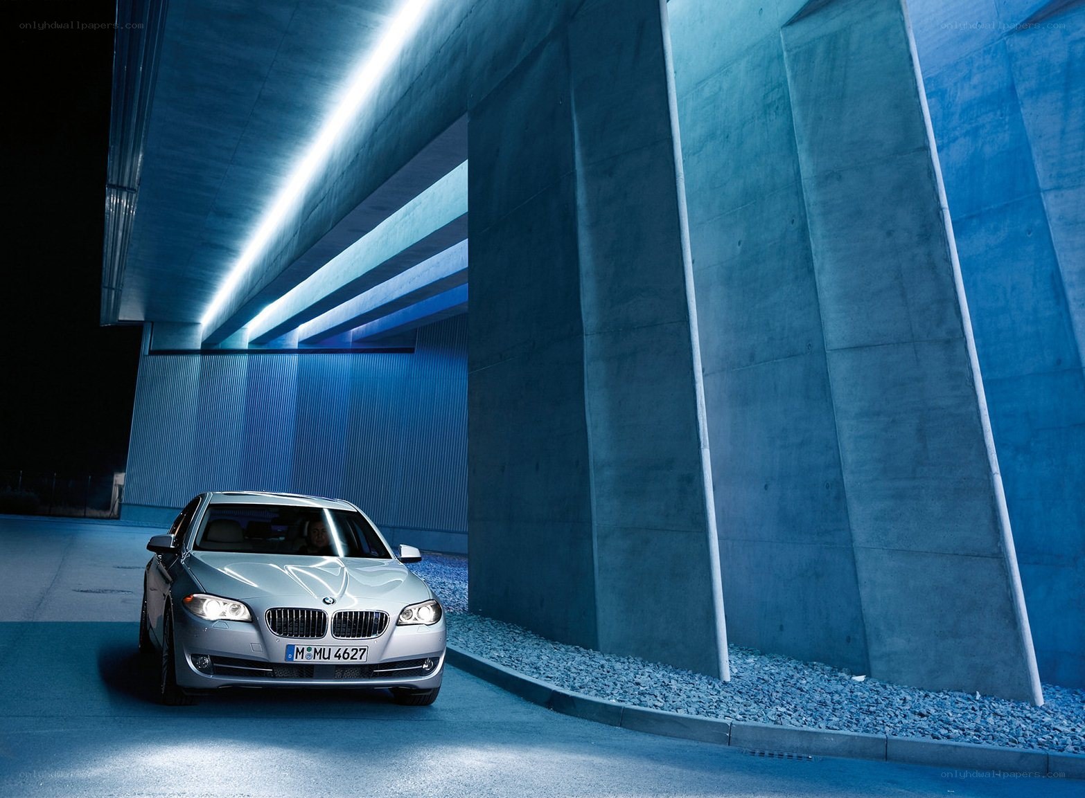 Silver BMW in a blue tunnel