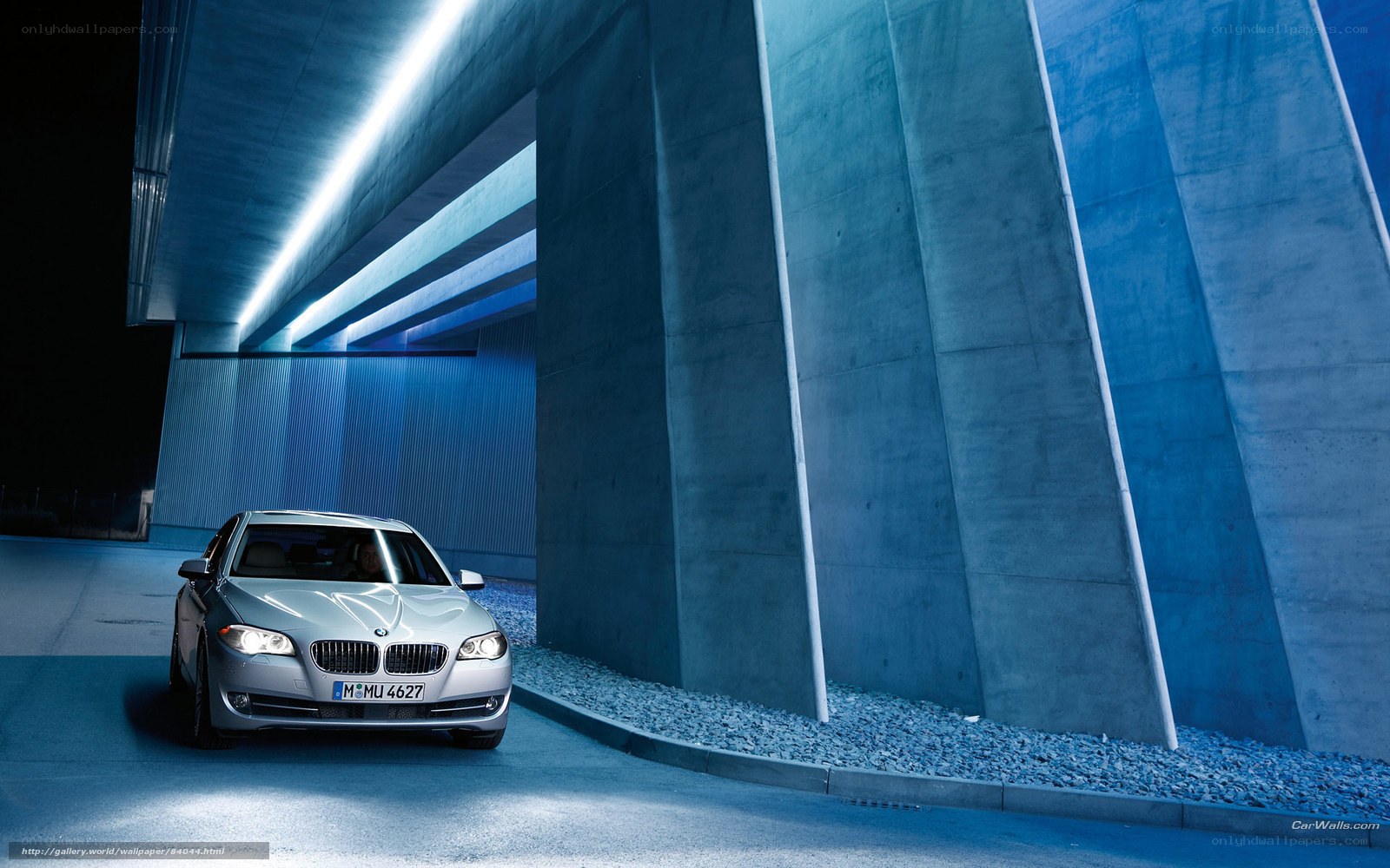 Silver BMW in a modern tunnel