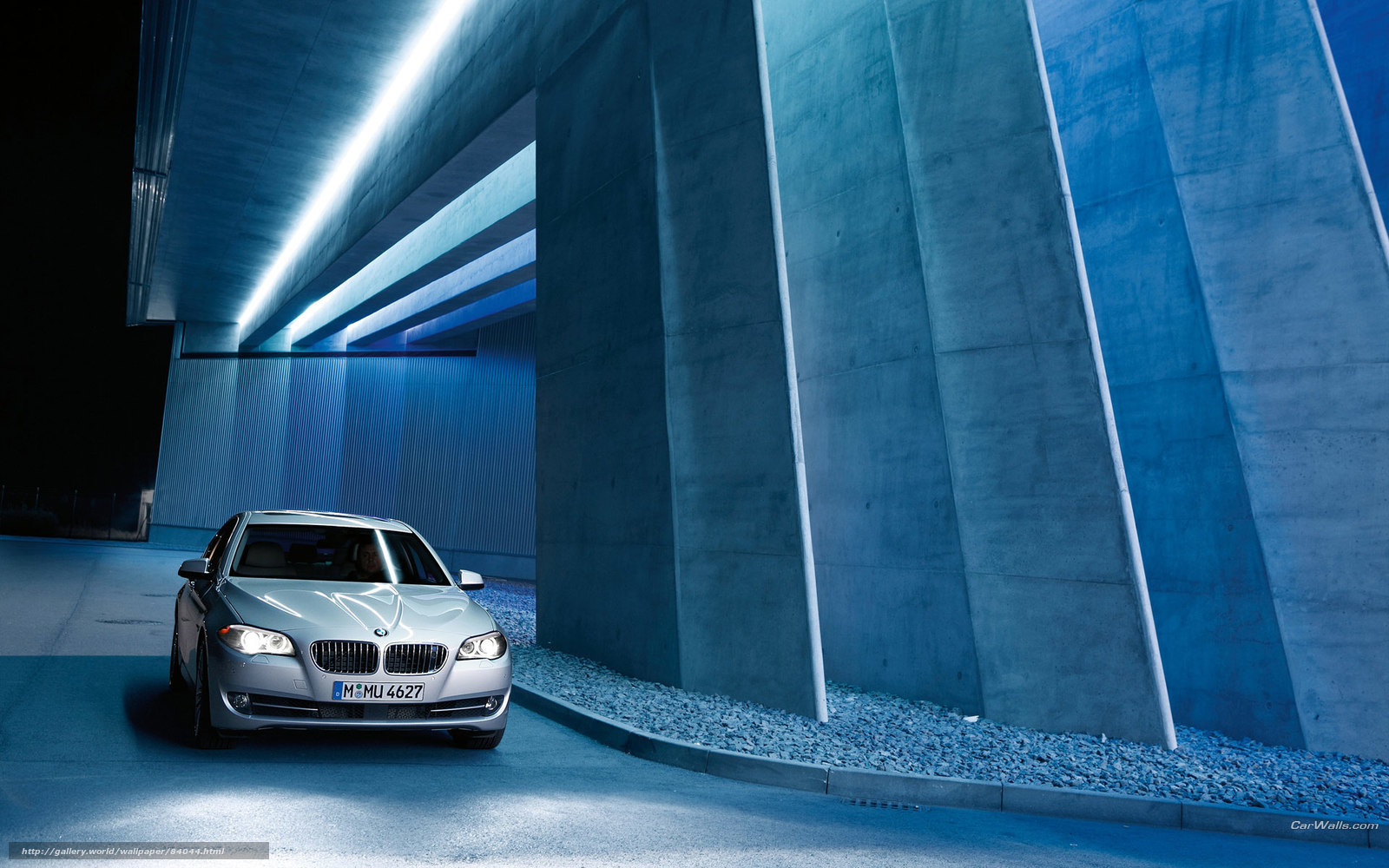 Silver BMW in a modern tunnel