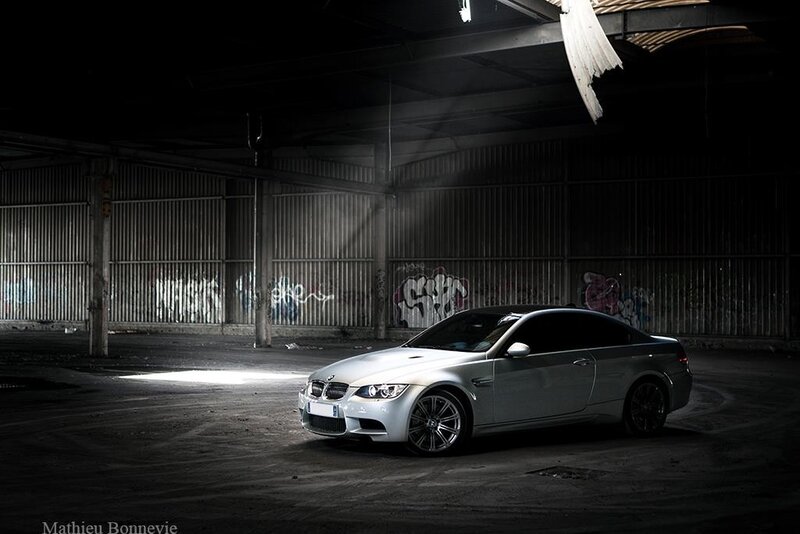 Silver BMW in an abandoned warehouse