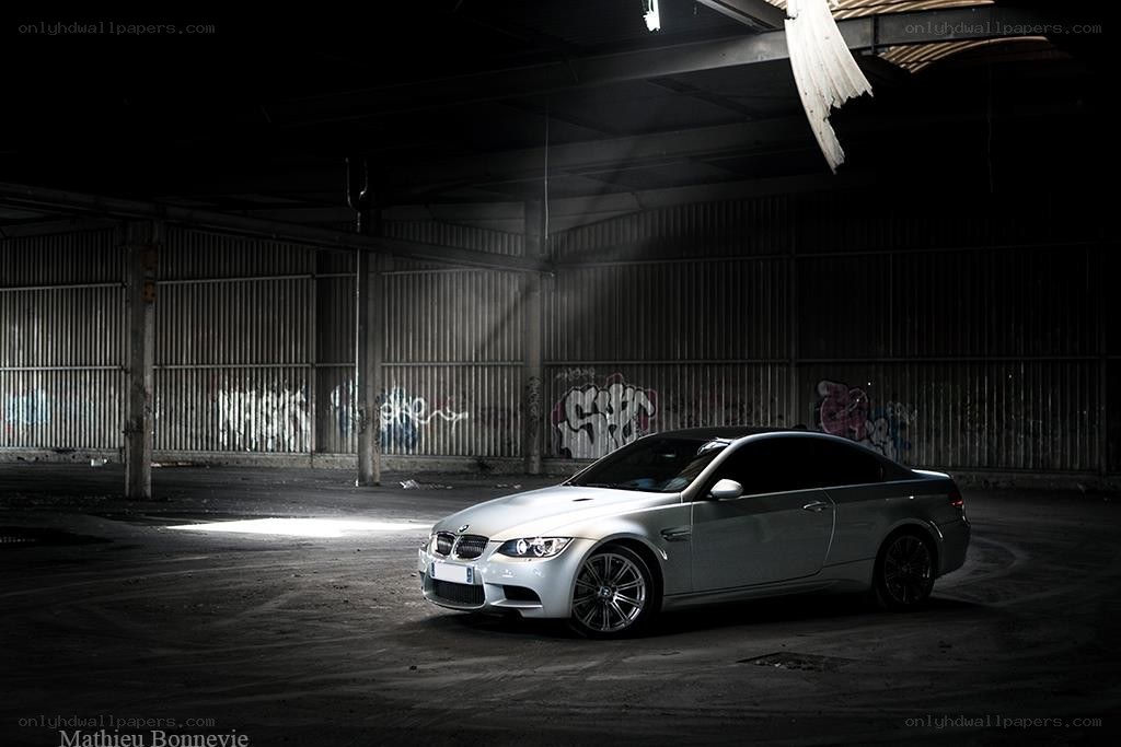 Silver BMW in an abandoned warehouse