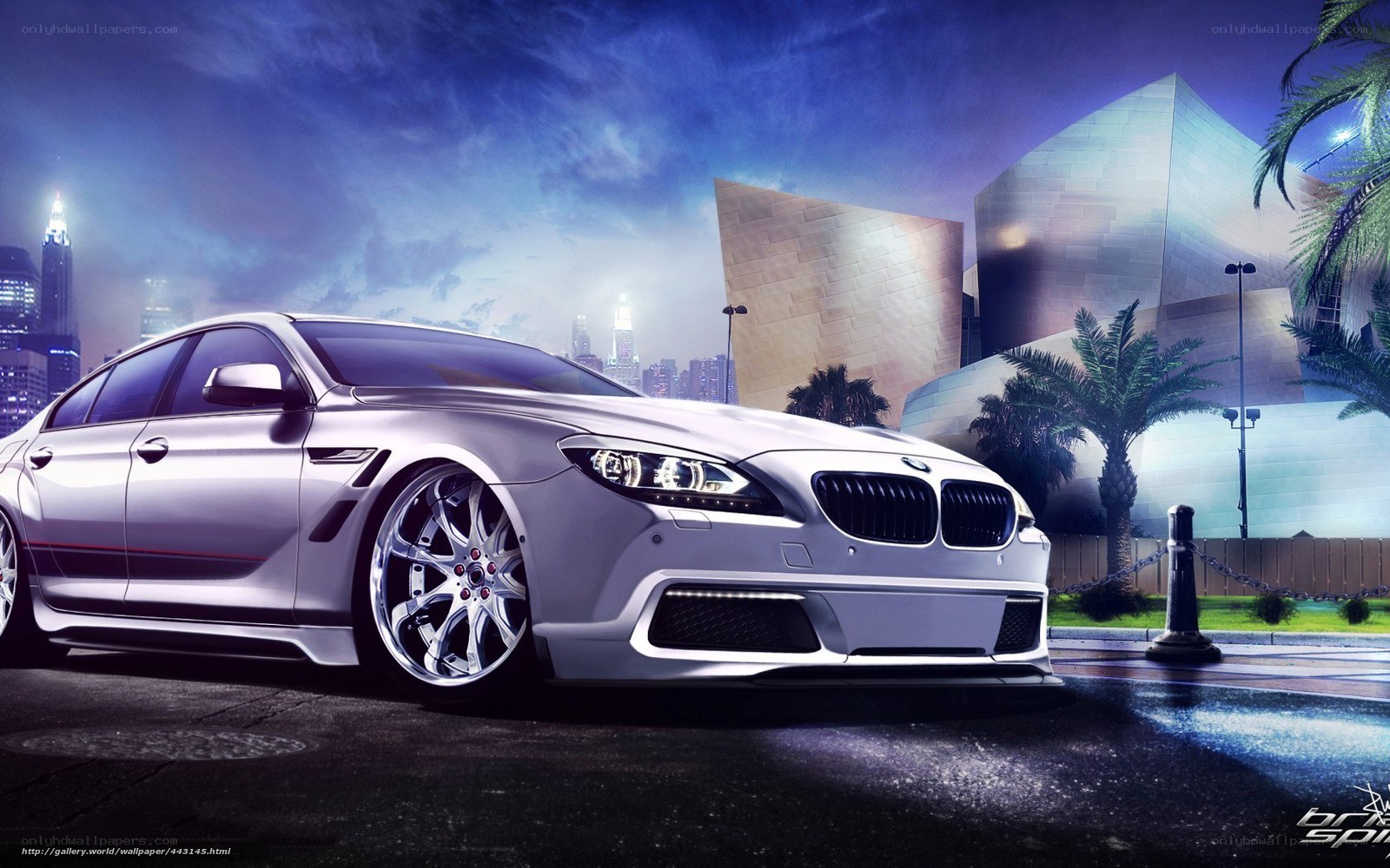 Silver BMW in city at night