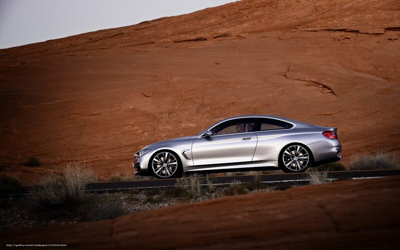Silver BMW in desert landscape