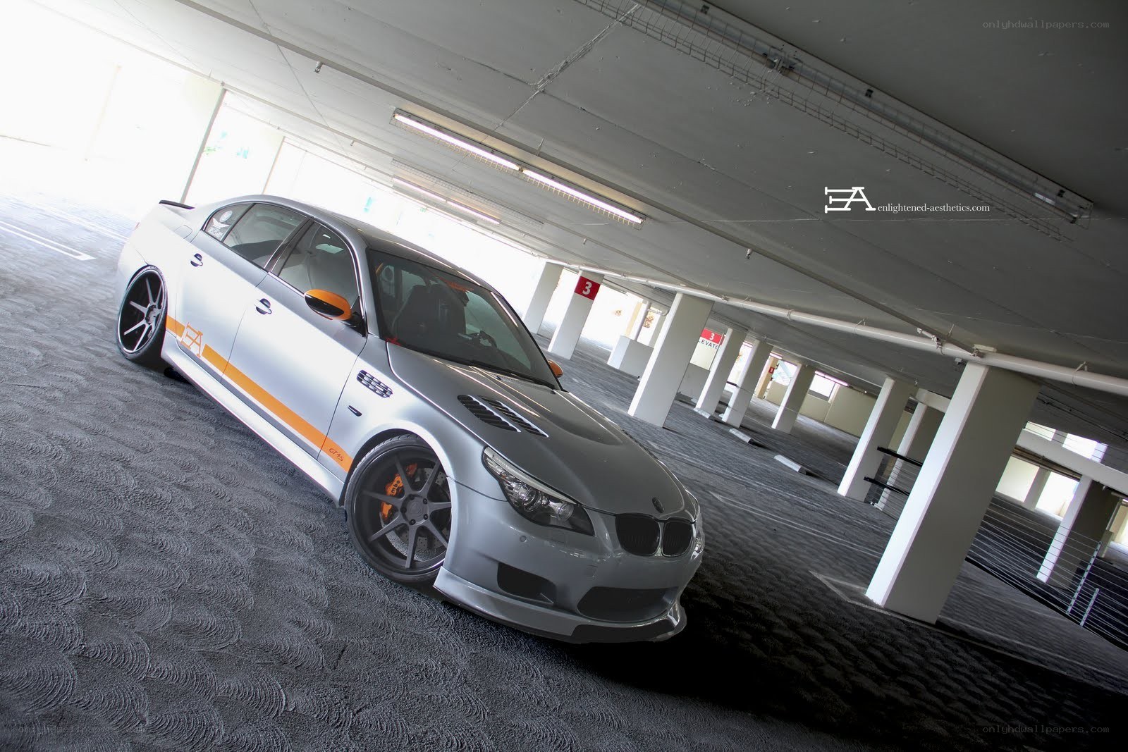 silver bmw in parking garage
