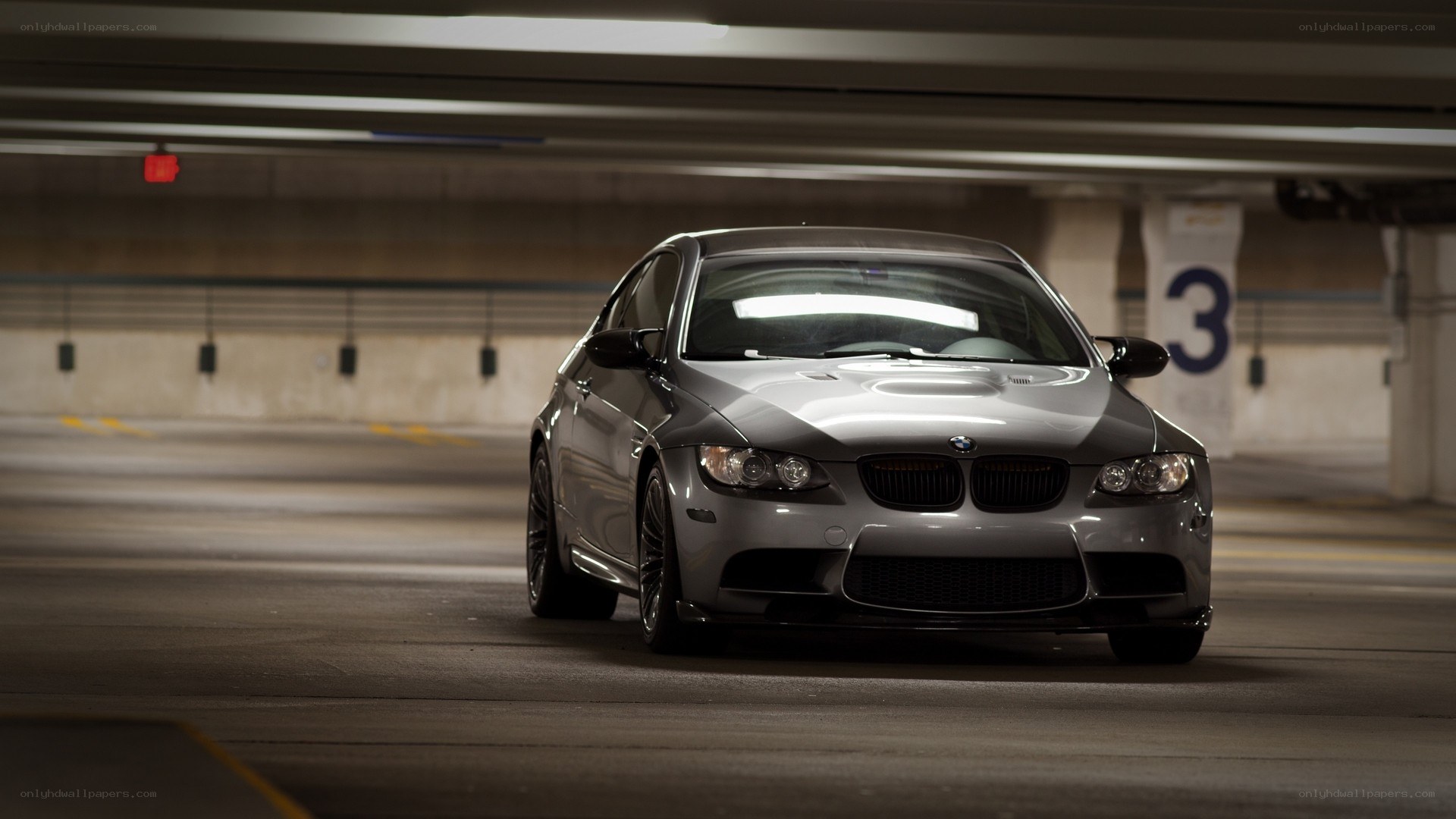Silver BMW in parking garage