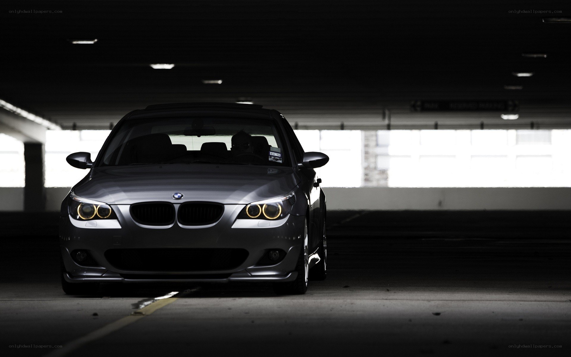 silver bmw in parking garage