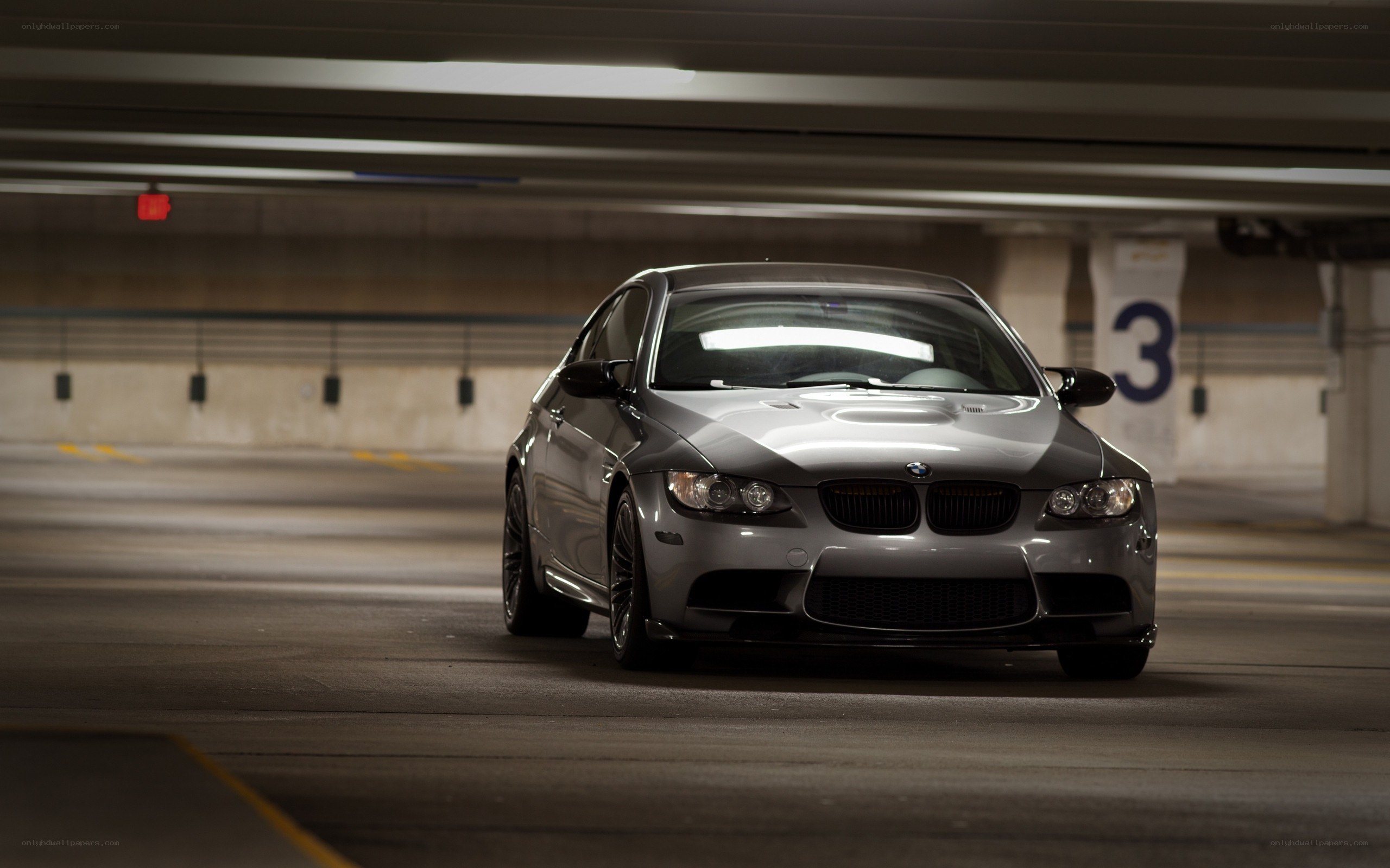 Silver BMW in parking garage