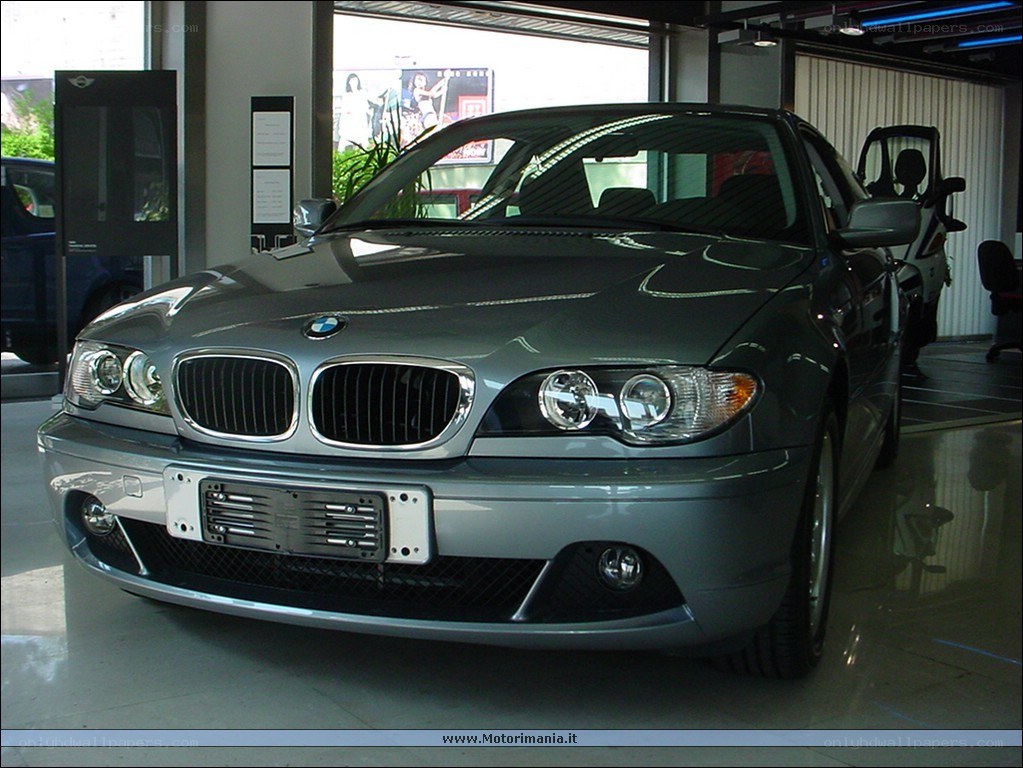 silver bmw in showroom
