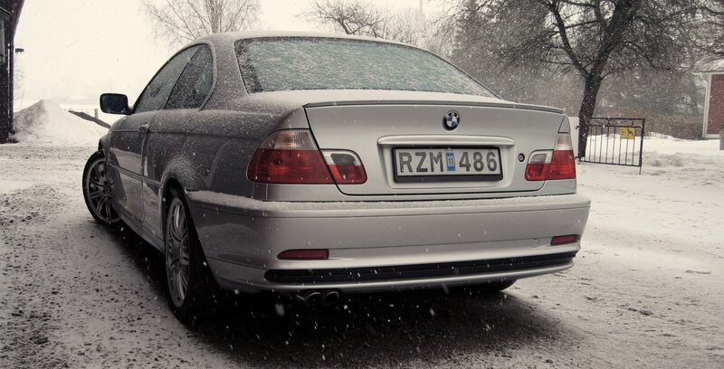 silver bmw in snow