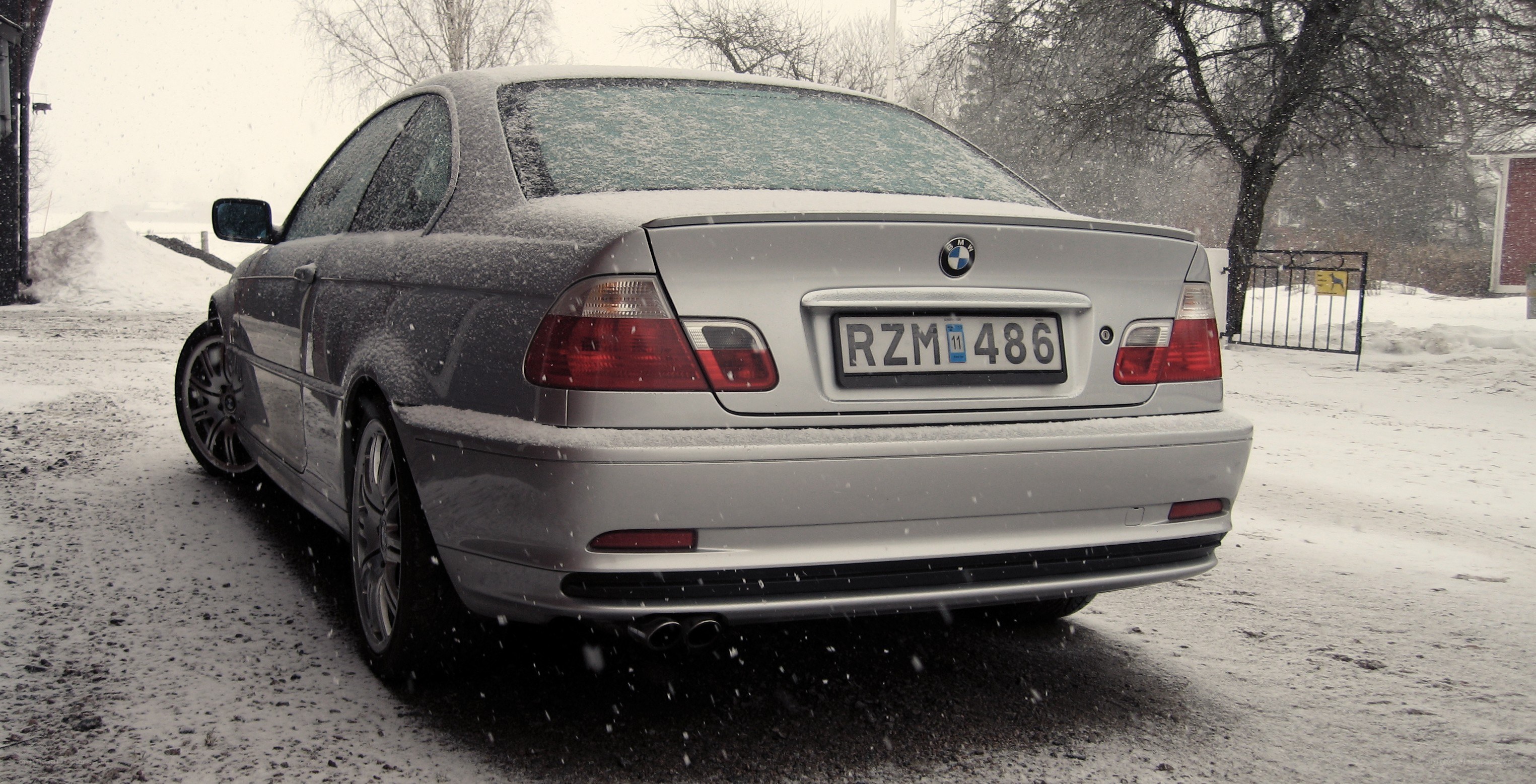 silver bmw in snow