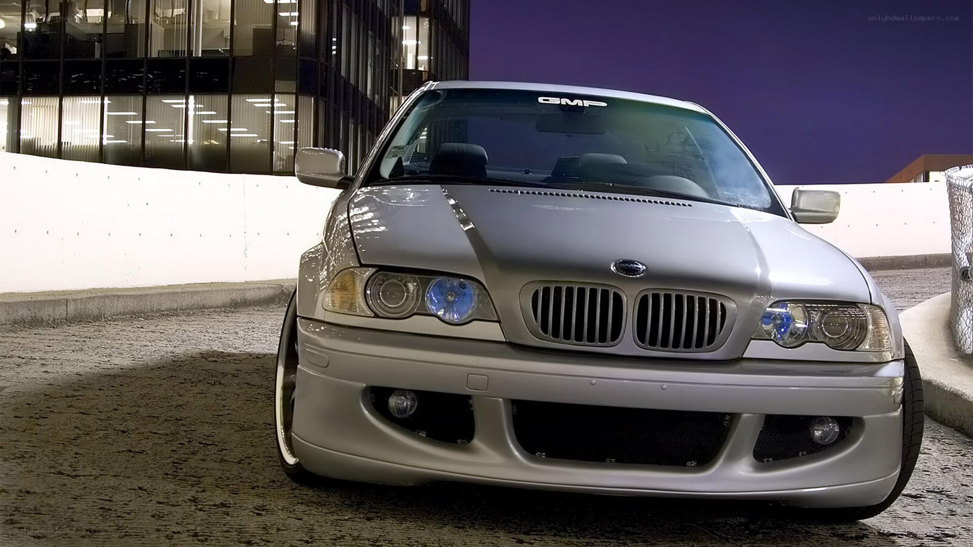silver bmw in urban setting