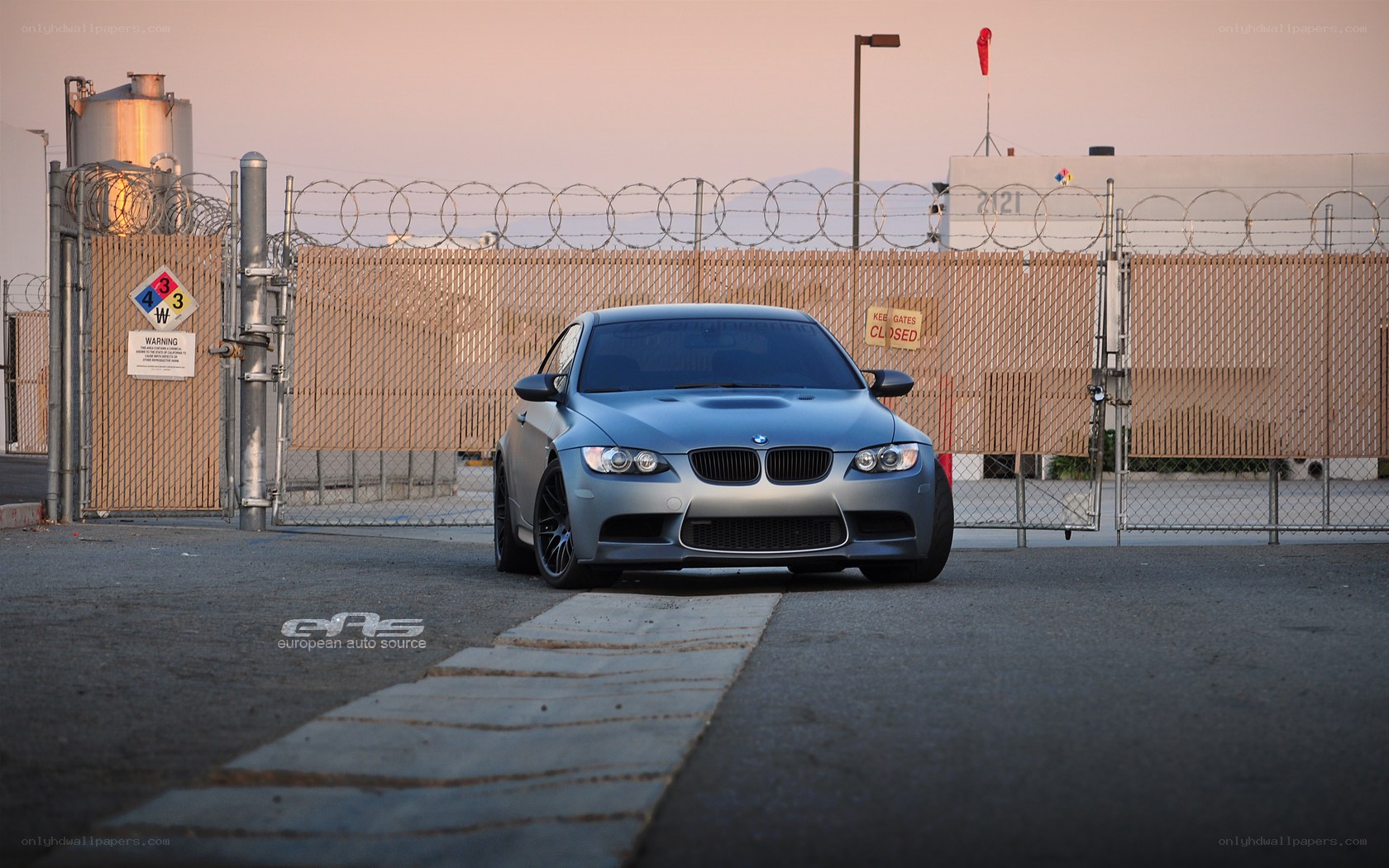 Silver BMW M3 at a secured facility