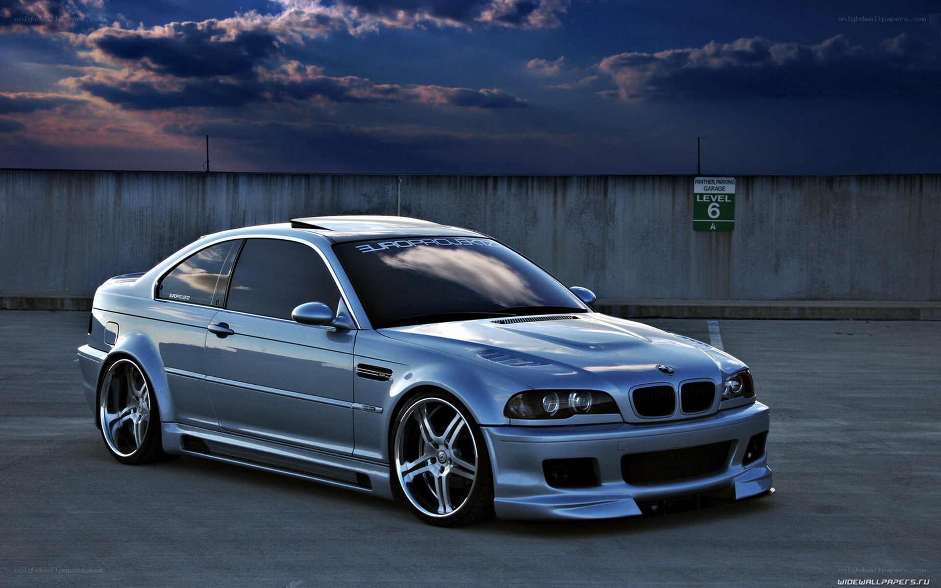 silver bmw m3 at dusk