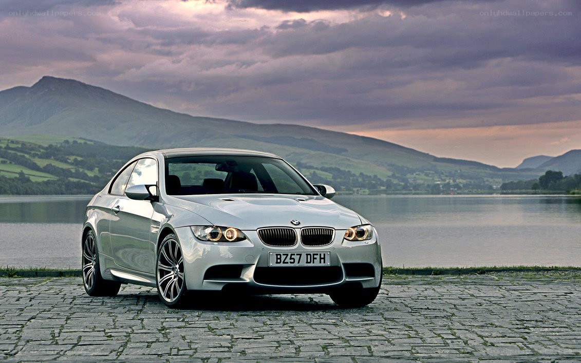Silver BMW M3 by a lake