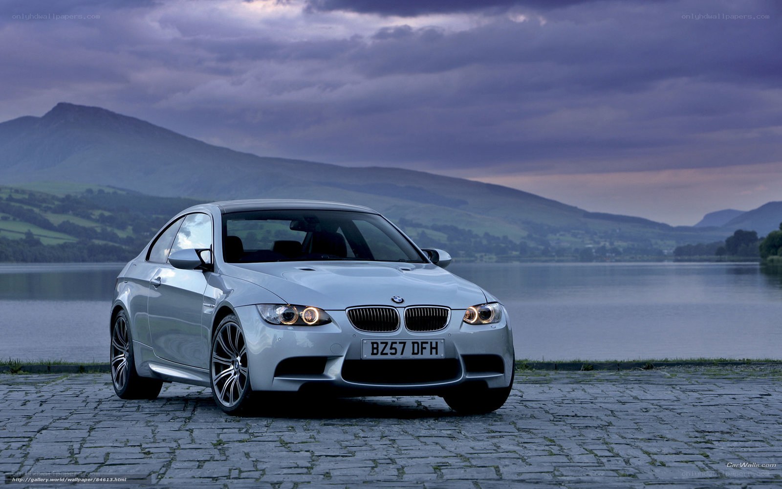 Silver BMW M3 by a lake