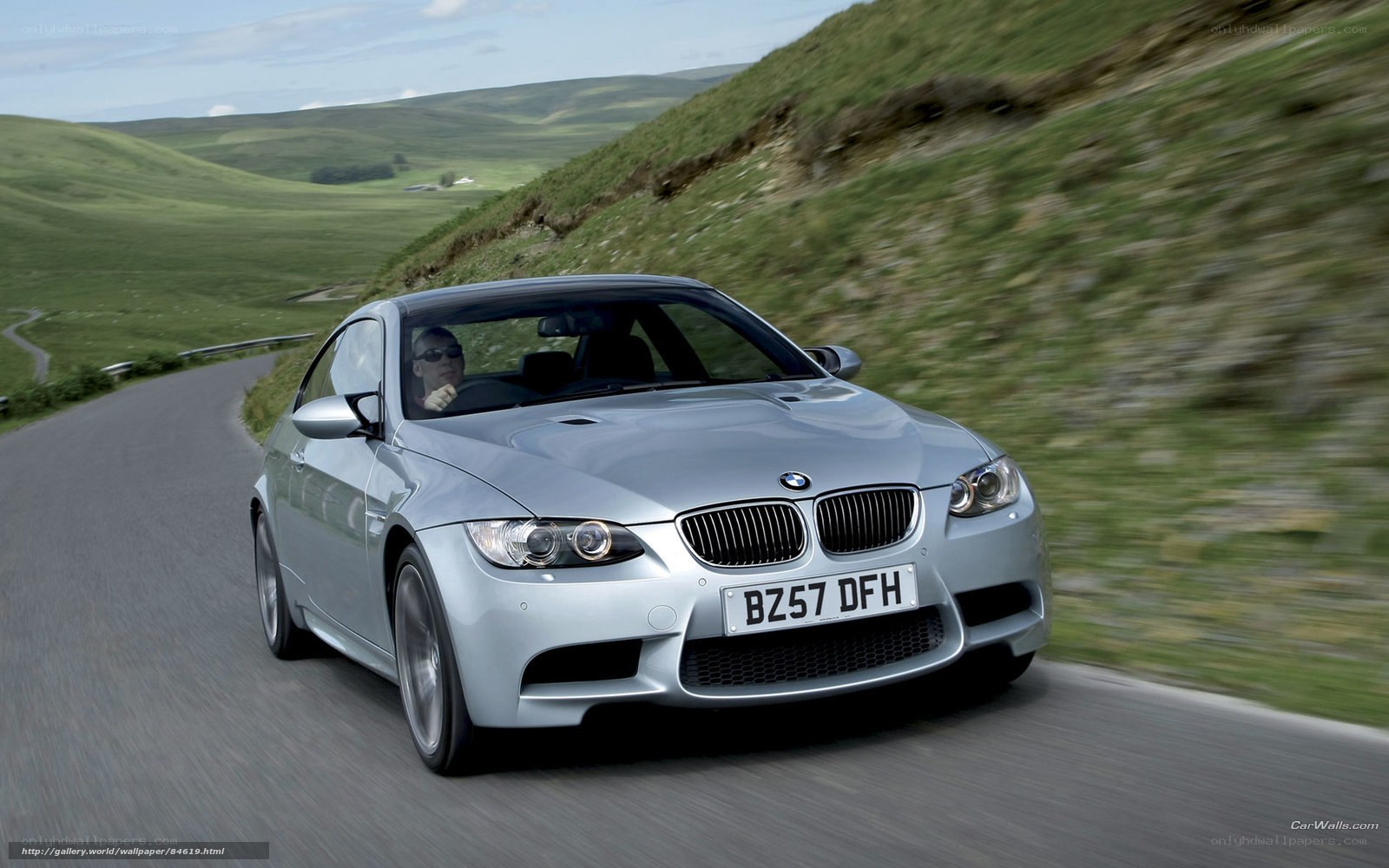 silver bmw m3 driving on country road