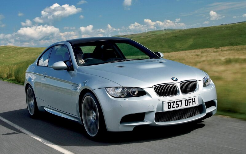 silver bmw m3 driving on road
