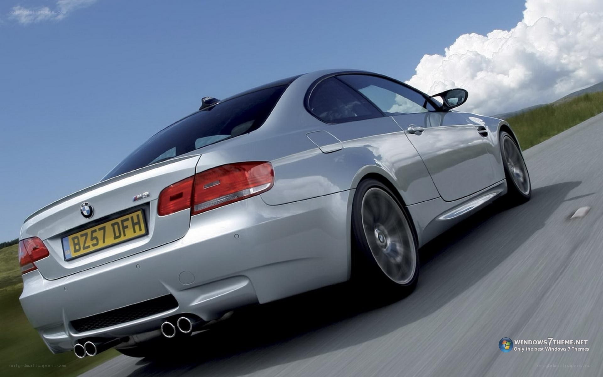silver bmw m3 driving on road