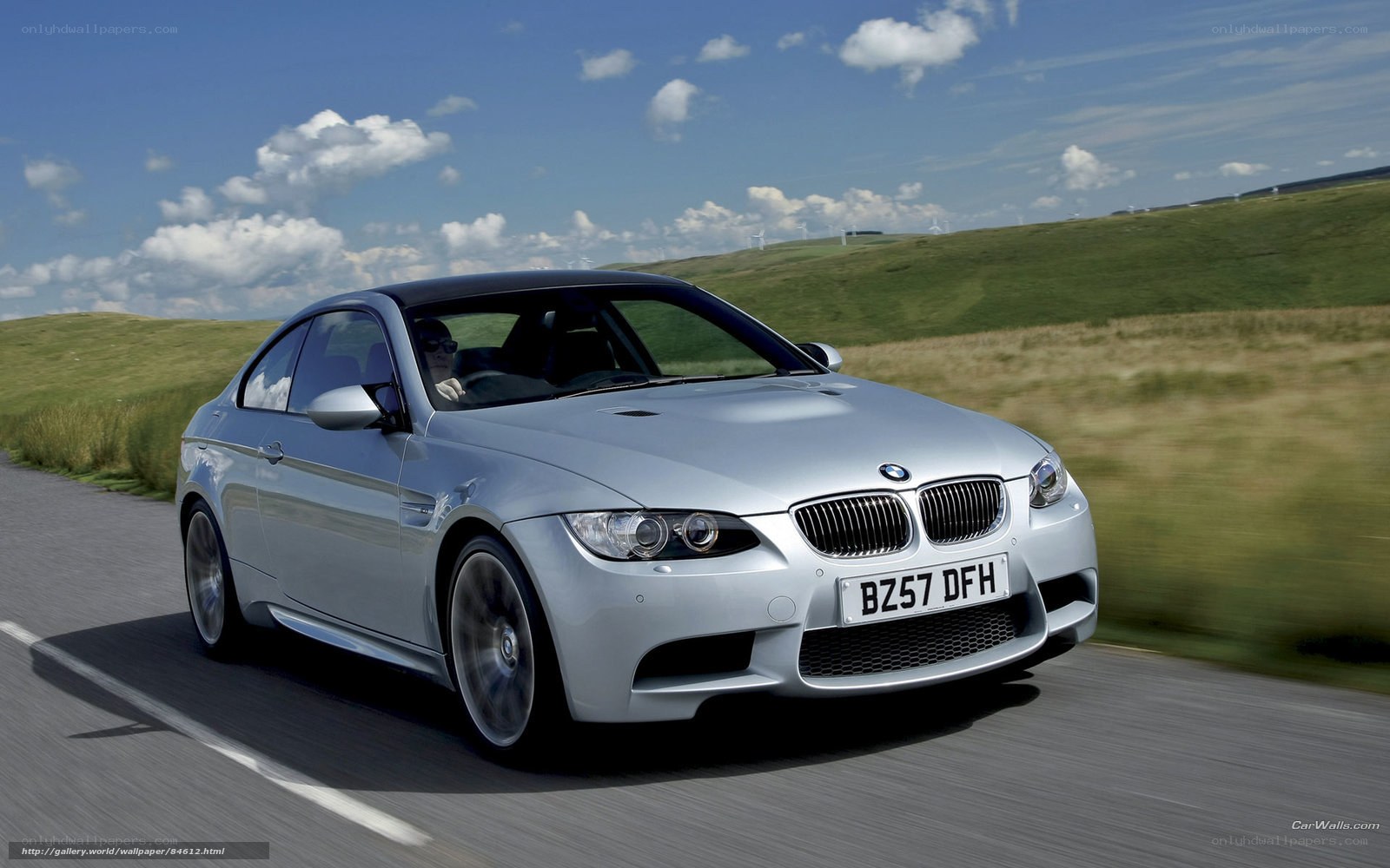 silver bmw m3 driving on road