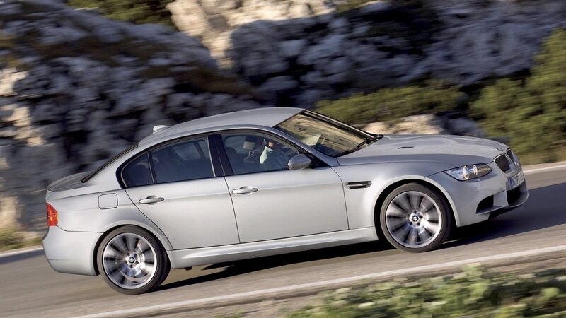 silver bmw m3 driving on road