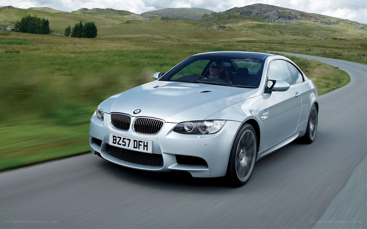 silver bmw m3 driving on road