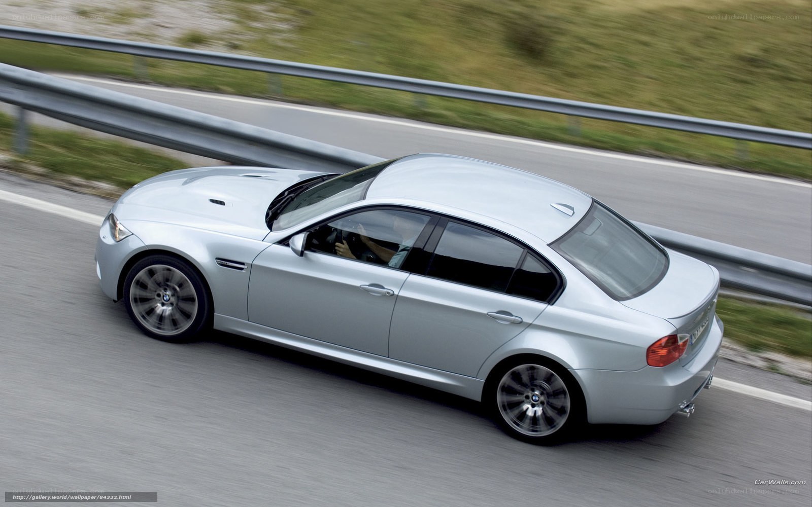 silver bmw m3 driving on road
