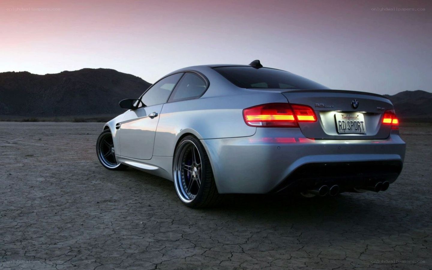 silver bmw m3 in desert