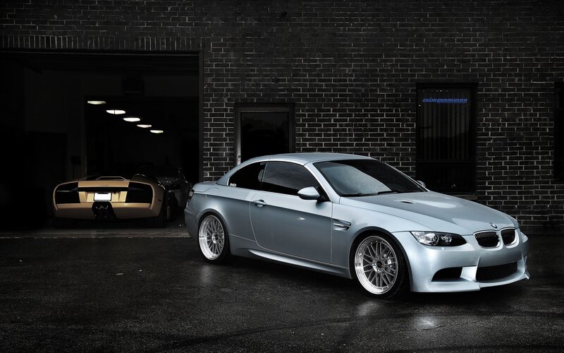 Silver BMW M3 in front of garage