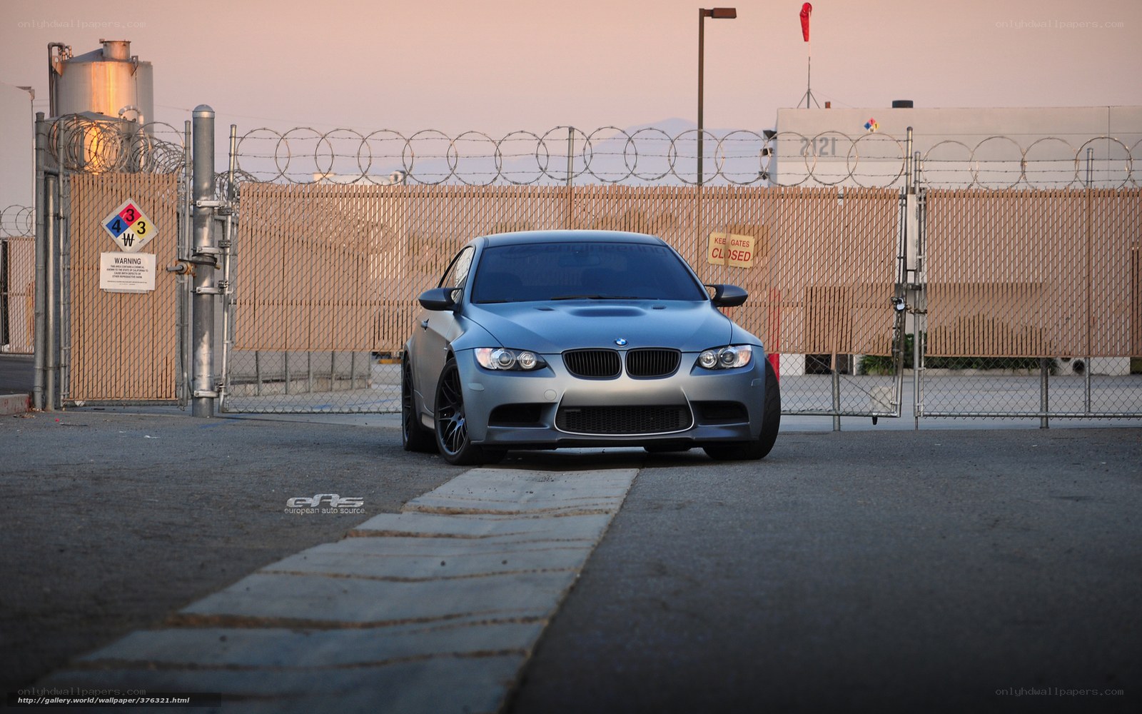 silver bmw m3 in industrial area