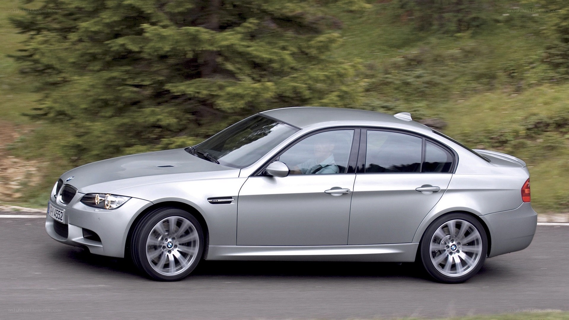 silver bmw m3 in motion