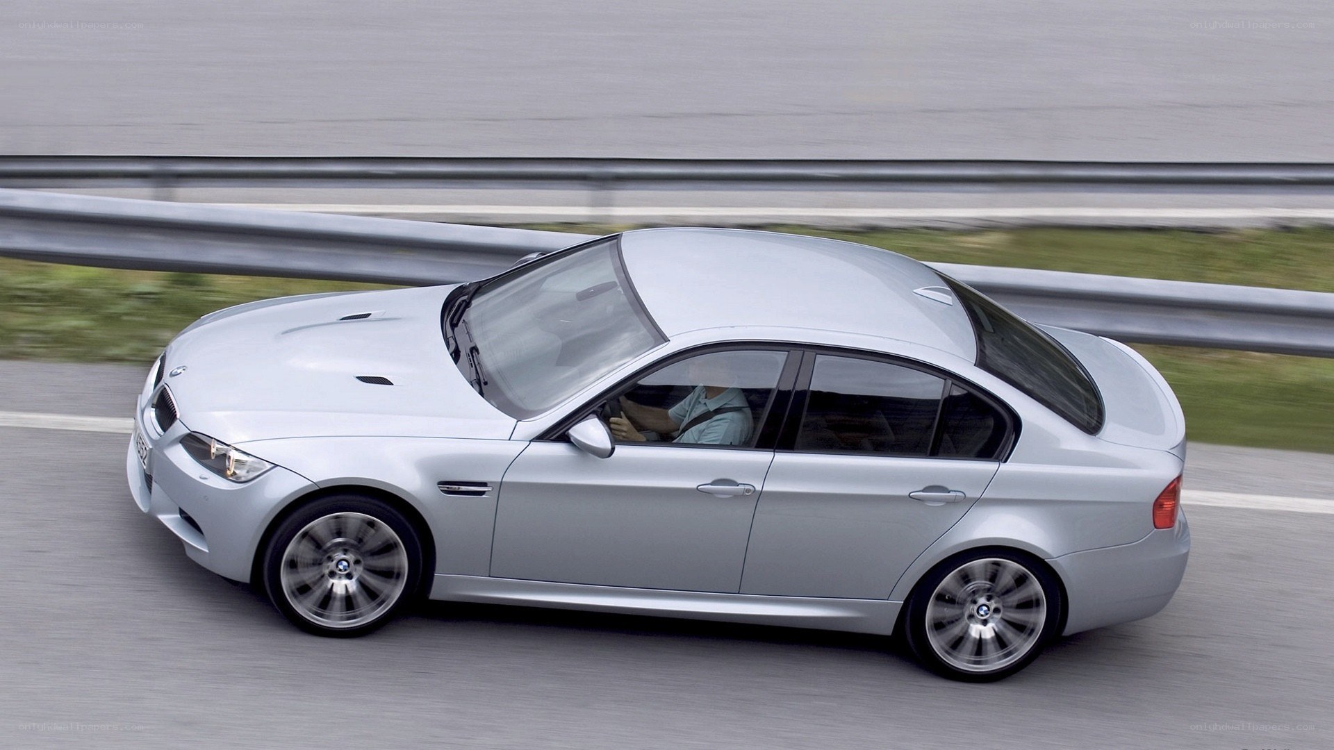 silver bmw m3 in motion