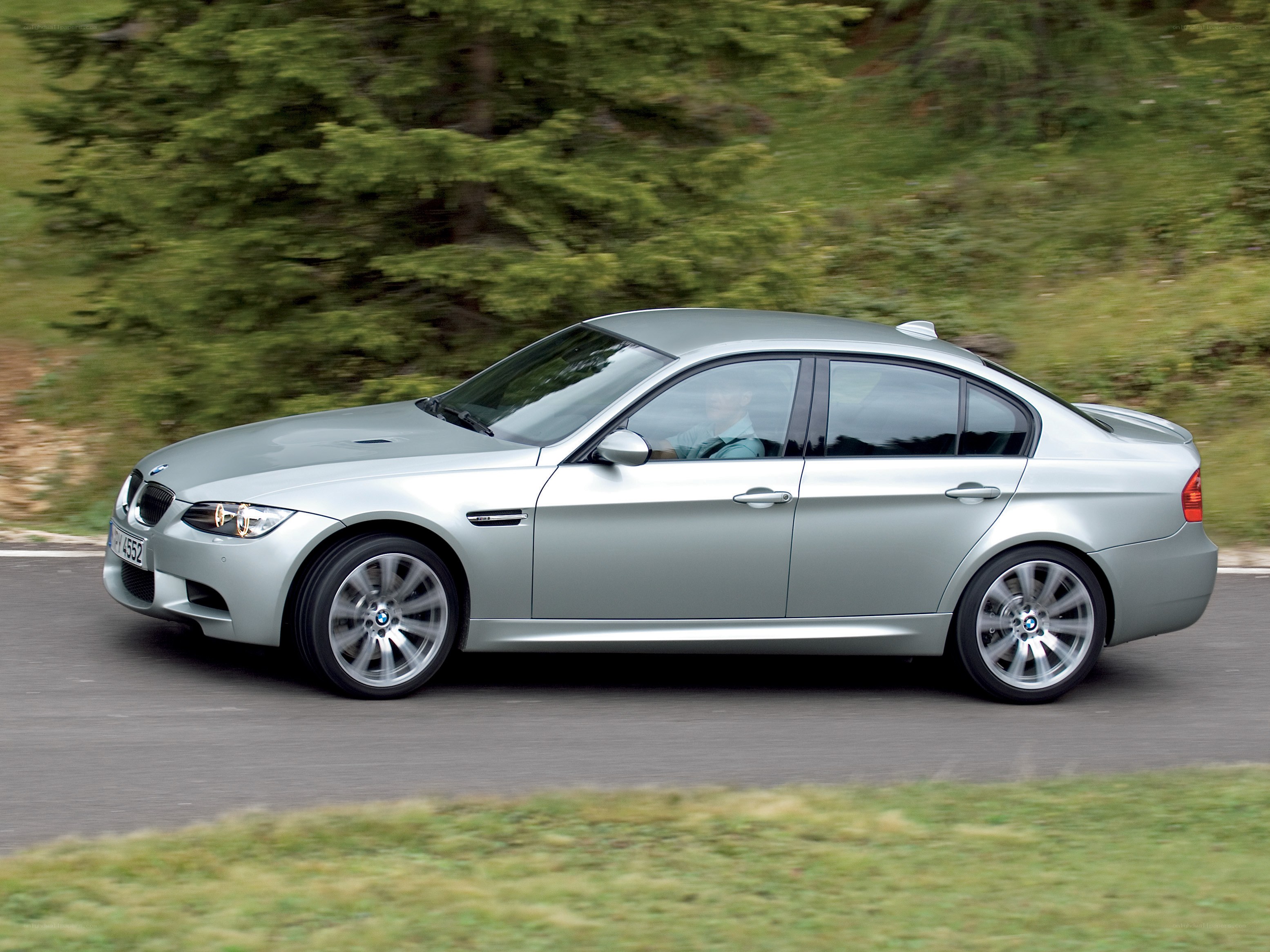 silver bmw m3 in motion