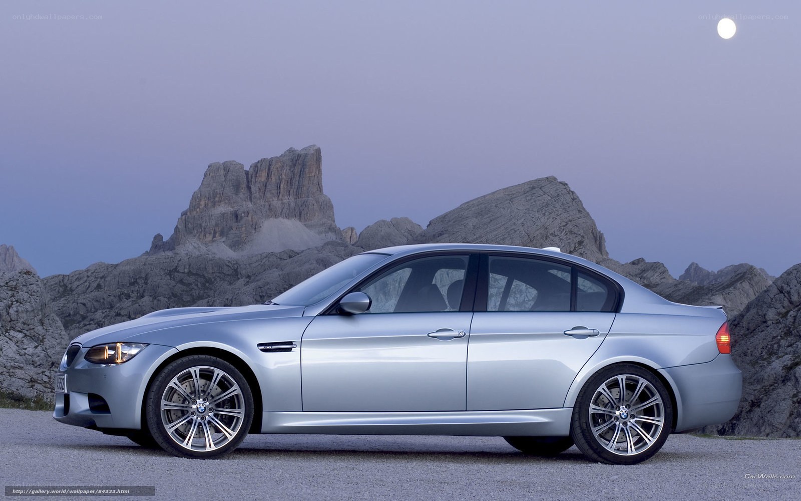 Silver BMW M3 in mountain landscape
