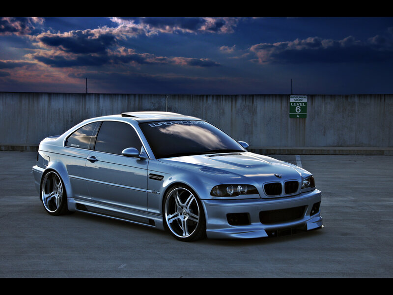 Silver BMW M3 in parking garage