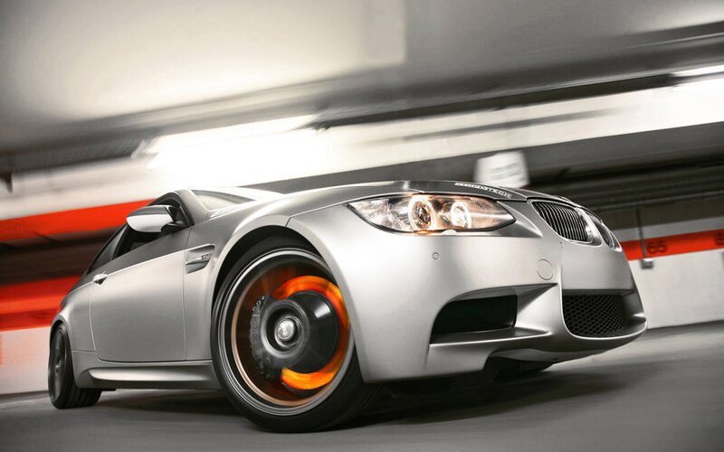 silver bmw m3 in parking garage