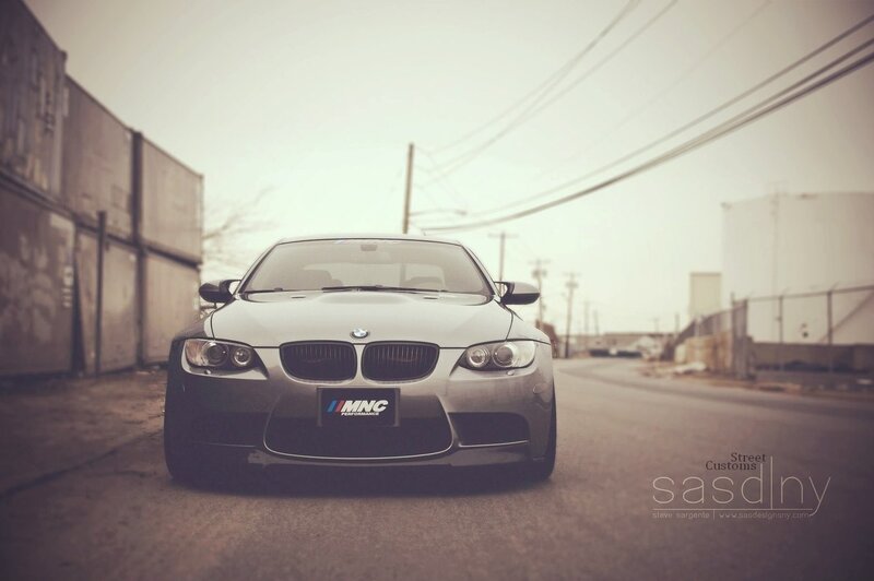 silver bmw m3 on a city street