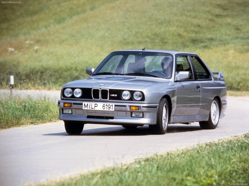 Silver BMW M3 on a country road