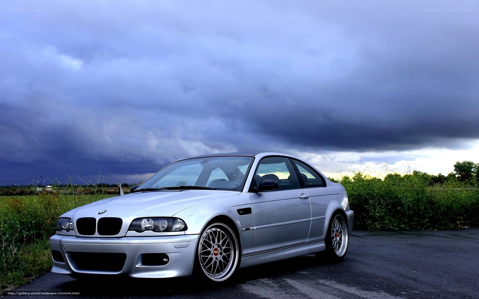 silver bmw m3 on a stormy day