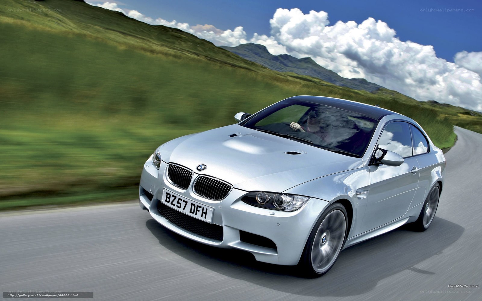 Silver BMW M3 on a winding road